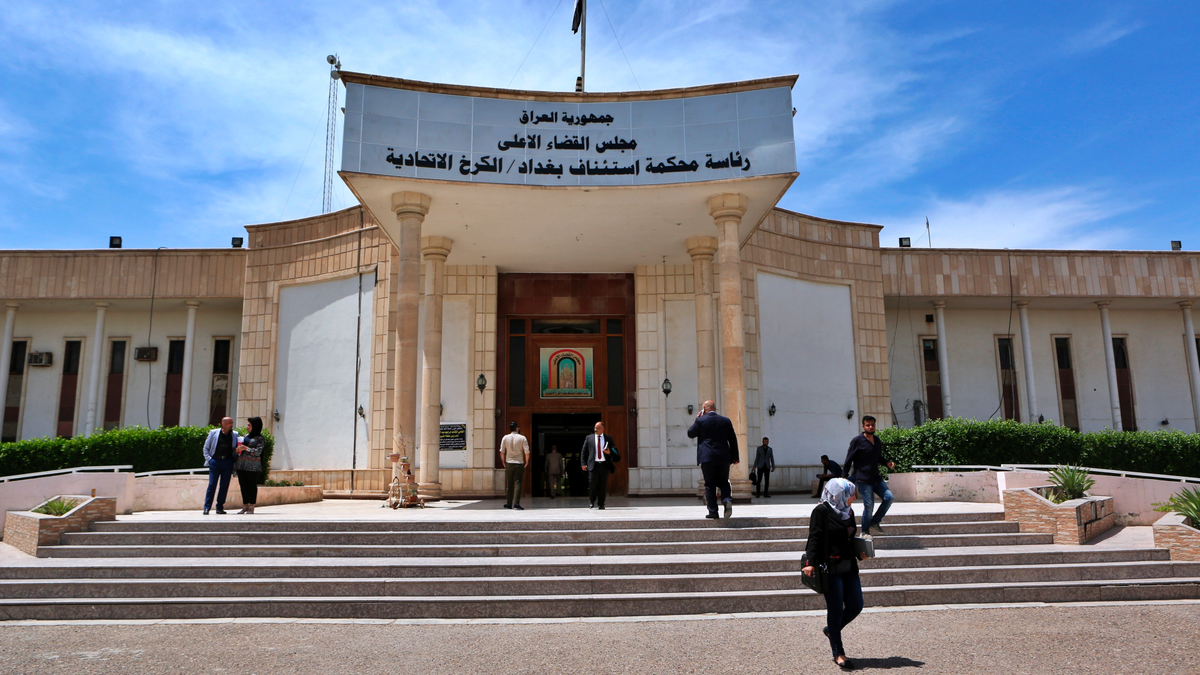 In this Sunday, May 5, 2019 file photo, people walk outside Iraqi Criminal Court in Baghdad's Karkh district, Iraq.