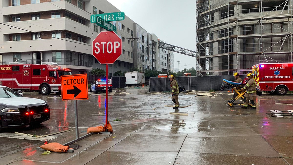 The crane fell into a downtown apartment building Sunday afternoon as strong winds, heavy rain and hail battered parts of North Texas. (Jordan Grinnell)