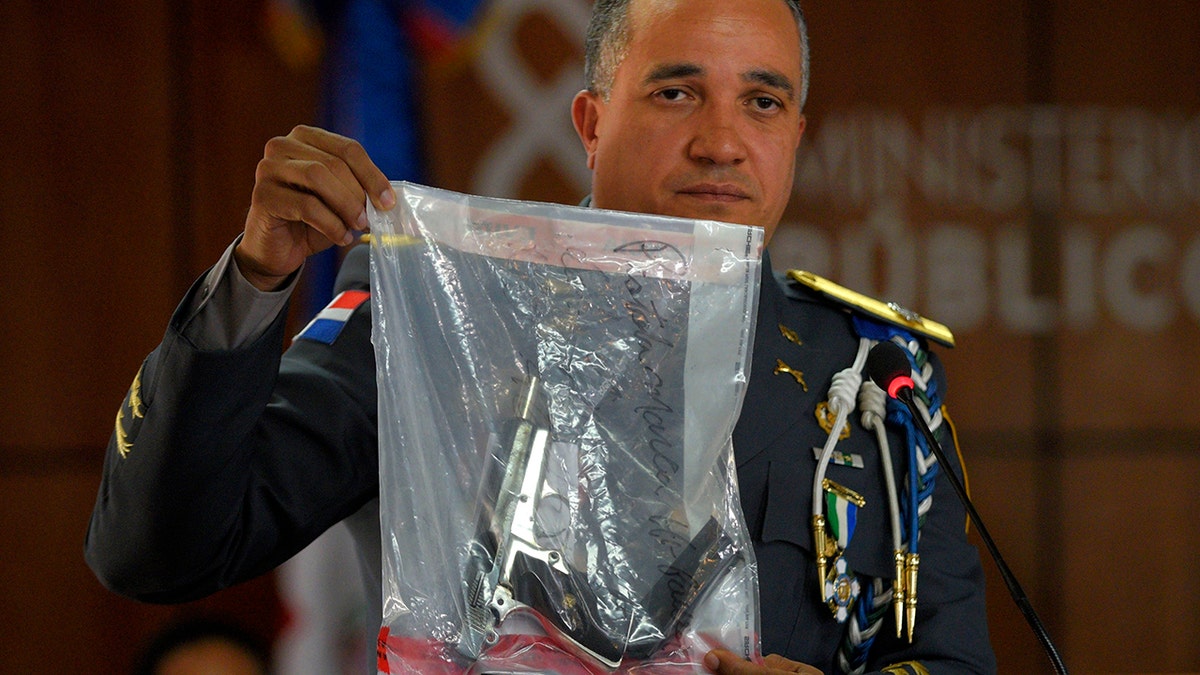 The director of the National Police, General Ney Aldrin Bautista Almonte shows the weapon that was used to shoot former Boston Red Sox slugger David Ortiz. (AP Photo / Roberto Guzman)