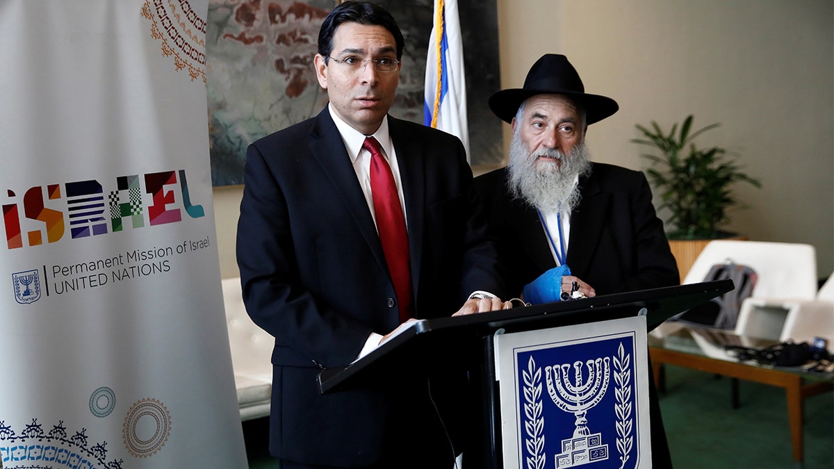 Israeli Ambassador to the United Nations Danny Danon and Rabbi Yisroel Goldstein address reporters Wednesday. (REUTERS/Shannon Stapleton)