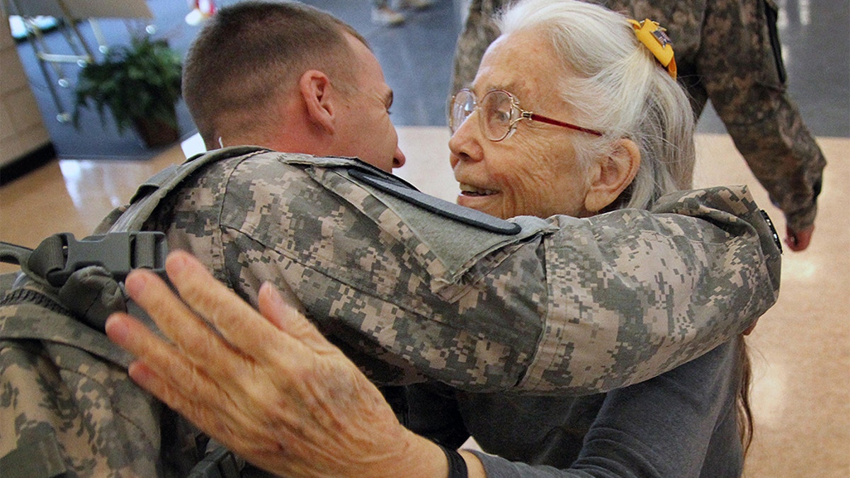 More than 82,000 signatures have been collected for a petition to rename the Fort Hood air terminal after the "hug lady," whose embrace boosted the spirits of thousands of American soldiers over nearly a decade as they shipped out for Iraq and Afghanistan. (AP Photo/The Killeen Daily Herald, Marianne Lijewski)