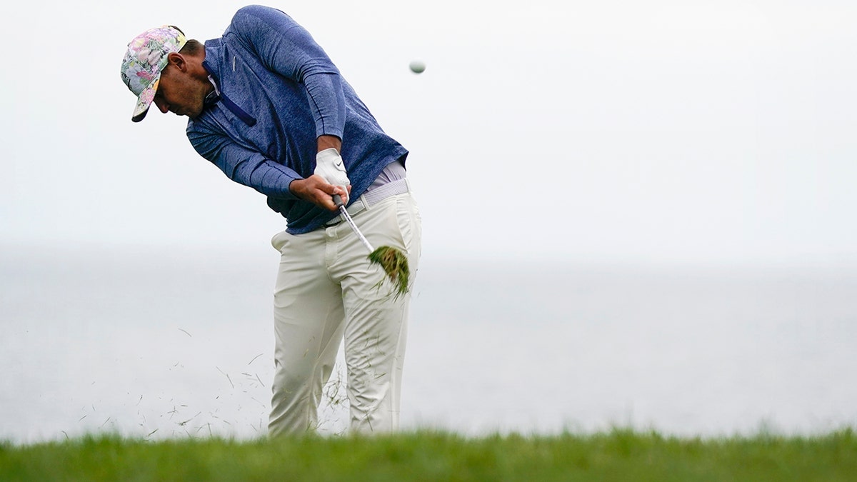 Brooks Koepka hits from the rough on the 11th hole during the first round of the U.S. Open Championship golf tournament Thursday, June 13, 2019, in Pebble Beach, Calif. (AP Photo/David J. Phillip)