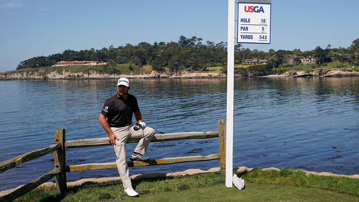 Graeme McDowell, of Northern Ireland, poses for a picture on the 18th hole during a practice round for the U.S. Open Championship golf tournament Tuesday, June 11, 2019, in Pebble Beach, Calif. (AP Photo/David J. Phillip)