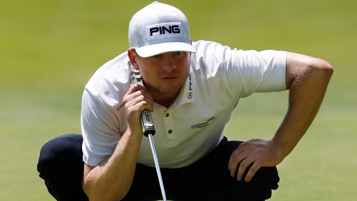 Nate Lashley eyes his putt on the 18th green during the first round of the Rocket Mortgage Classic golf tournament, Thursday, June 27, 2019, in Detroit. (AP Photo/Carlos Osorio)