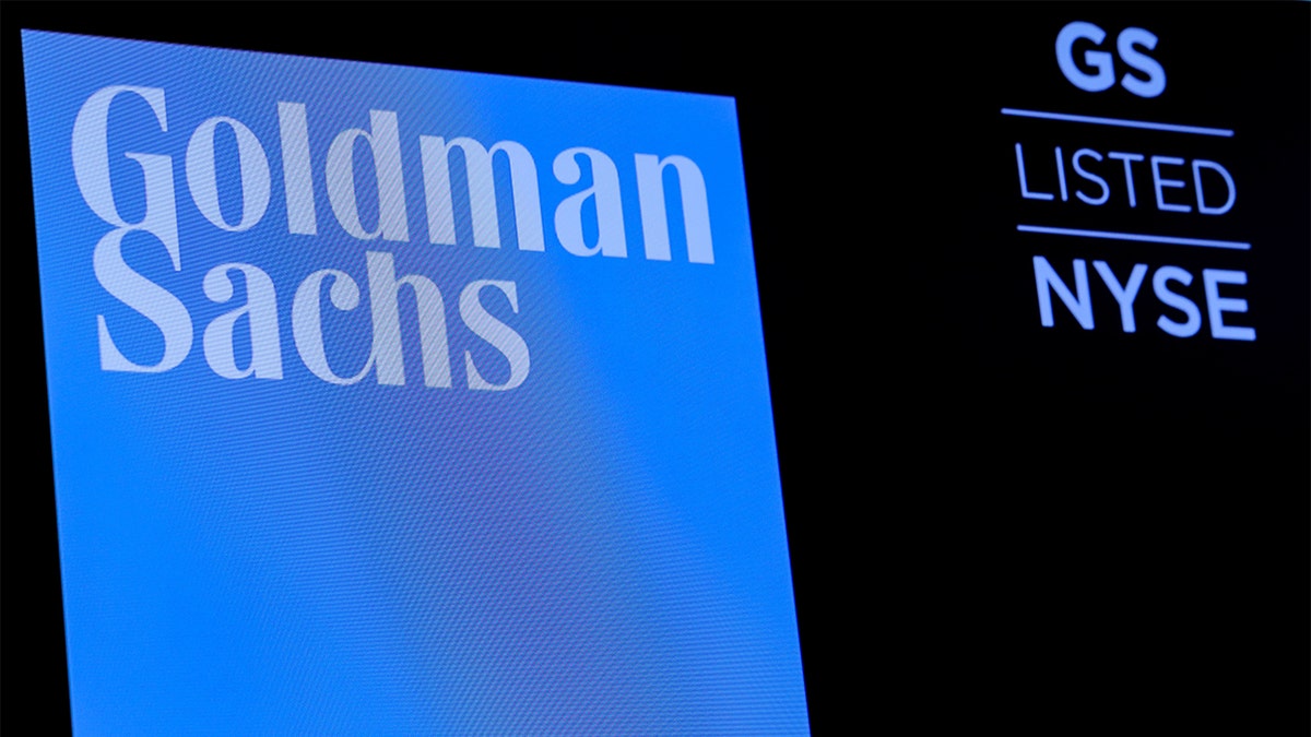 FILE PHOTO: The ticker symbol and logo for Goldman Sachs is displayed on a screen on the floor at the New York Stock Exchange (NYSE) in New York, U.S., December 18, 2018. REUTERS/Brendan McDermid/File Photo - RC1DD1B49500