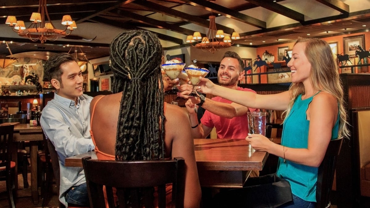 Guests enjoying LongHorn Steak and Bourbon Ice Cream