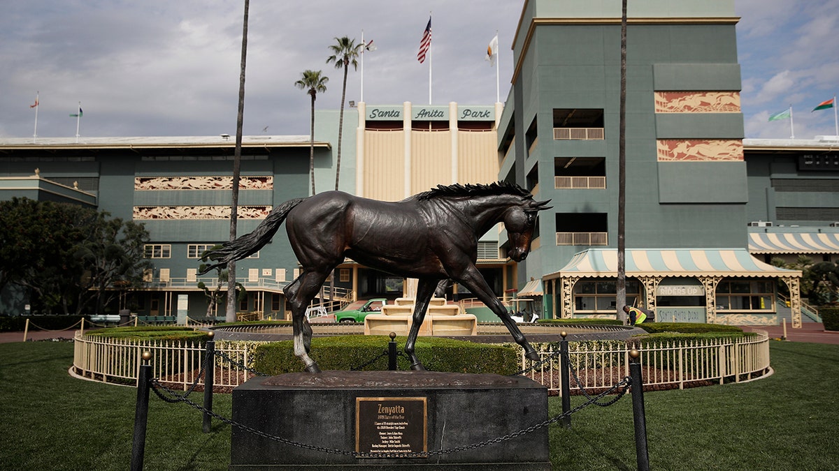 FILE - In this March 5, 2019, file photo, a statue of Zenyatta stands in the paddock gardens area at Santa Anita Park in Arcadia, Calif. A second horse in two days and 29th overall died at Santa Anita, Sunday, June 9, 2019, where management has chosen to continue racing for the rest of the current meet. (AP Photo/Jae C. Hong, File)