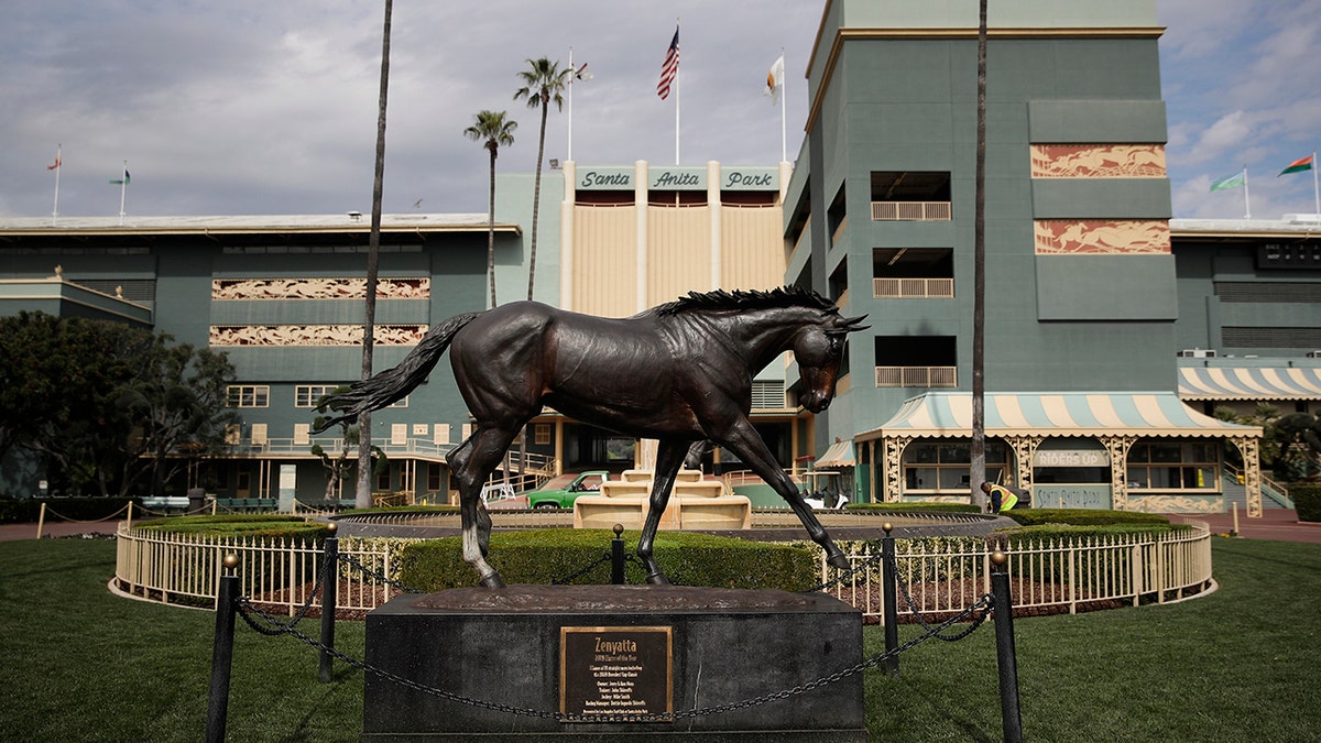 FILE - In this March 5, 2019, file photo, a statue of Zenyatta stands in the paddock gardens area at Santa Anita Park in Arcadia, Calif. A second horse in two days and 29th overall died at Santa Anita, Sunday, June 9, 2019, where management has chosen to continue racing for the rest of the current meet. (AP Photo/Jae C. Hong, File)
