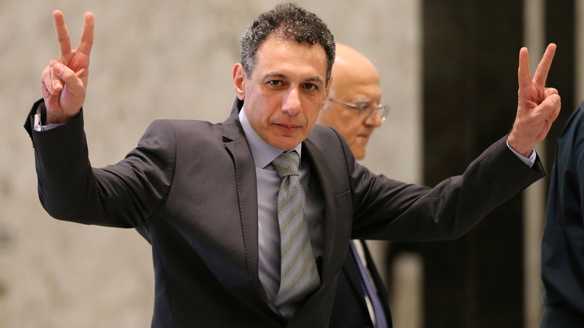 Nizar Zakka, a Lebanese citizen and U.S. permanent resident, who was released in Tehran after nearly four years in jail on charges of spying, flashes victory signs upon his arrival at the presidential palace, in Baabda, east of Beirut, Tuesday, June 11, 2019. Zakka a Lebanese businessman was allowed to fly to Lebanon, a development that comes amid heightened tensions between Iran and the U.S. after President Donald Trump withdrew America from Tehran's nuclear deal with world powers. 