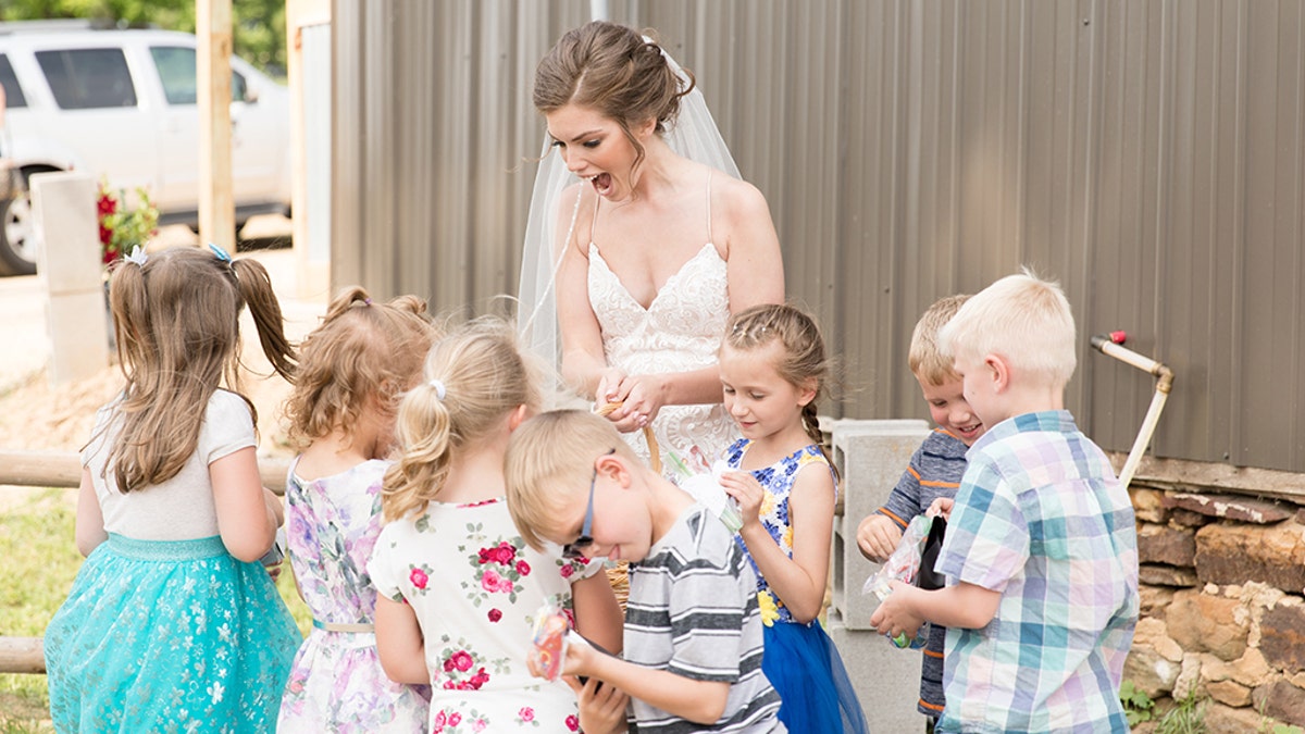 Eight of Geary’s former students surprised their teacher on her big day with hugs, cheers and a lemonade-and-cookie reception.