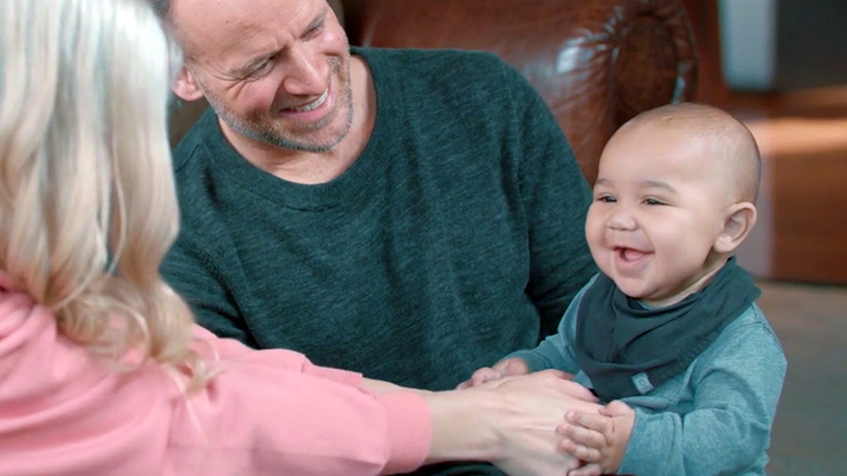 Brian and Jenn Johnson with their two-year-old son, Ryder Moses.