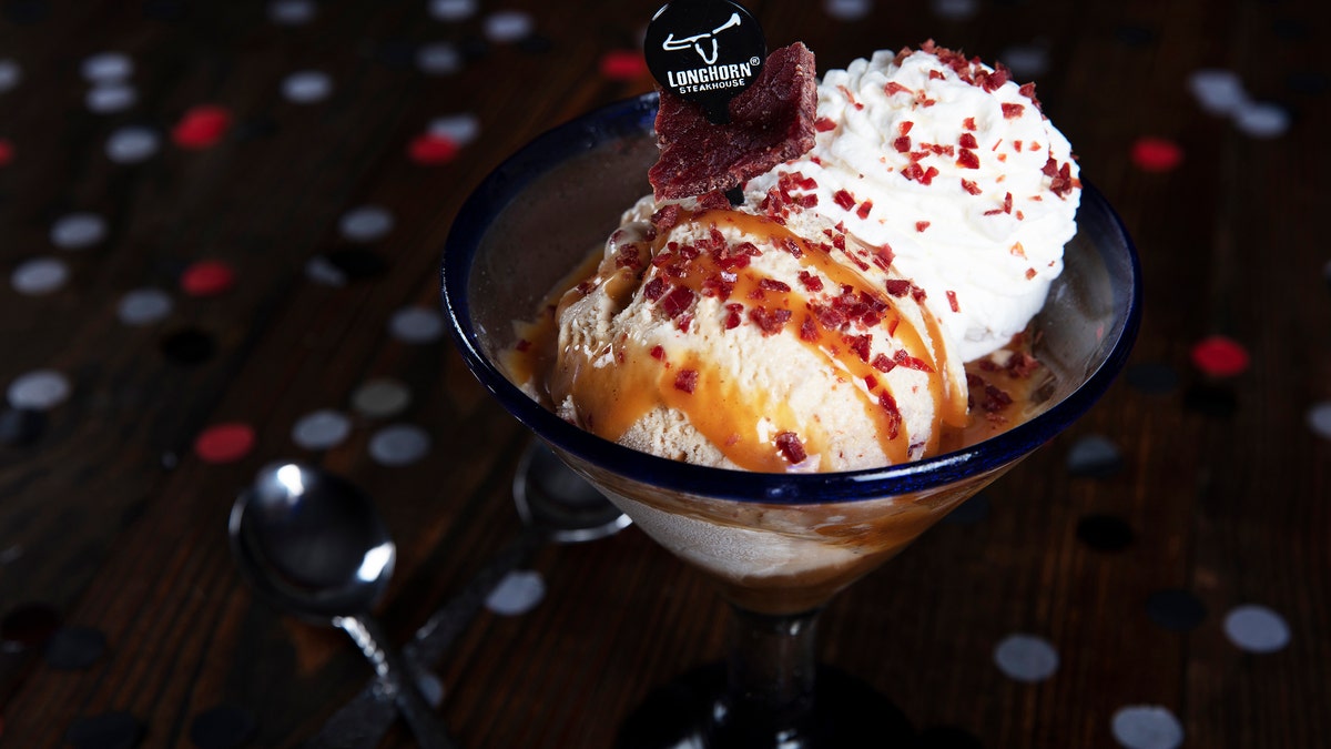 The ice cream itself is swirled with bourbon caramel and bits of steak. It's served with Longhorn's seasoning, bourbon caramel sauce, whipped cream and addition bits of steak.