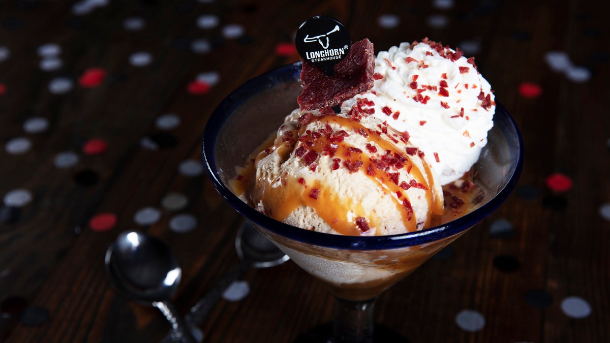 The ice cream itself is swirled with bourbon caramel and bits of steak. It's served with Longhorn's seasoning, bourbon caramel sauce, whipped cream and addition bits of steak.