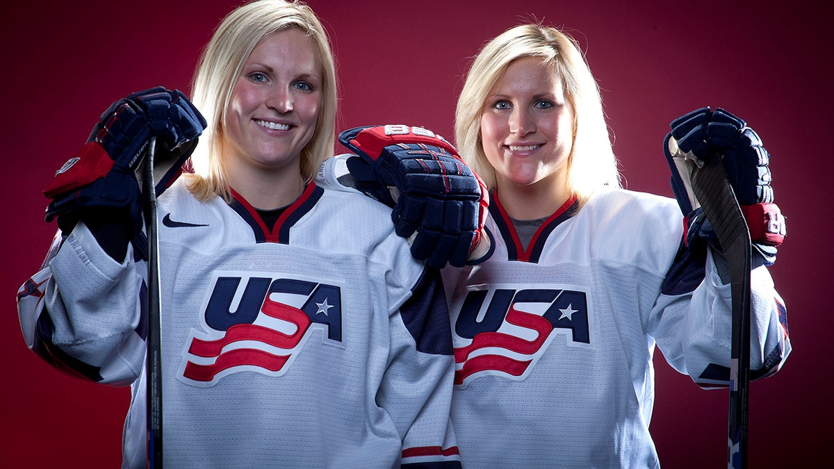 FILE - In this Oct. 2, 2013, file photo, United States Olympic Winter Games Hockey players Jocelyne Lamoureux, left, and Monique Lamoureux pose for a portrait at the Team USA Media Summit in Park City, Utah. (AP Photo/Carlo Allegri, File)
