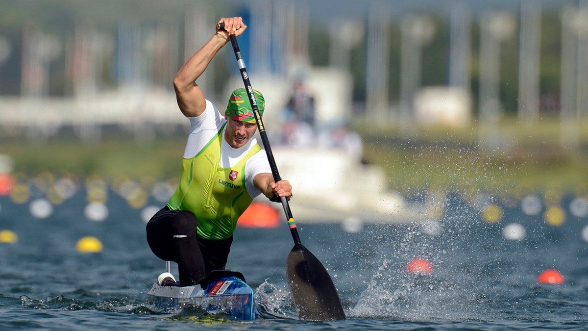 Olympic silver medalist Jevgenij Shuklin has been disqualified from the 2012 London Olympics for doping with an anabolic steroid. The IOC has yet to reallocate medals. (AP Photo/Philip Brown, Pool, File)