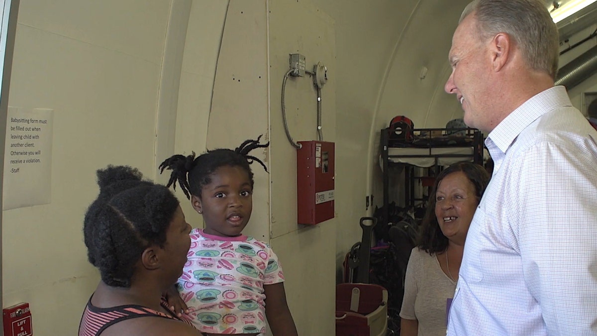 San Diego Mayor Kevin Faulconer talks to residents at a homeless shelter. (Photo courtesy of Matt Shupe)