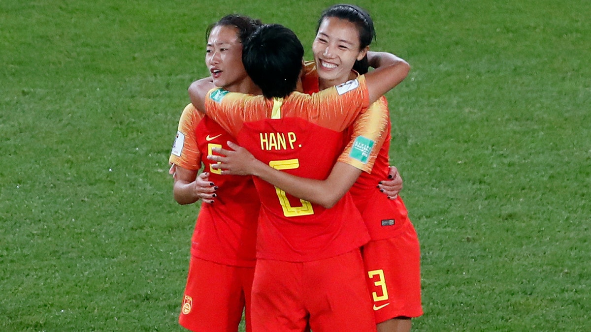China's Wu Haiyan, China's Han Peng, and China's Lin Yuping, from left to right, celebrate their 1-0 win at the end of the Women's World Cup Group B soccer match between China and South Africa at the Parc des Princes in Paris, France, Thursday, June 13, 2019. (AP Photo/Thibault Camus)