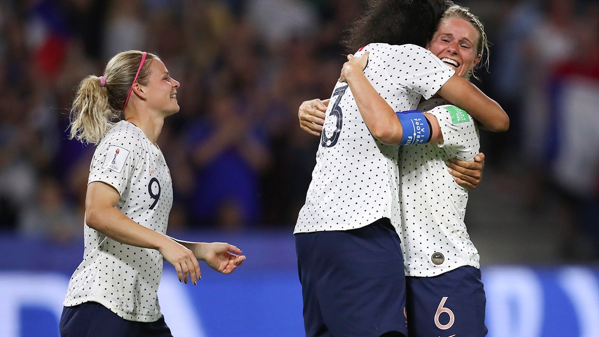 France's Amandine Henry, right, celebrates with France's Wendie Renard, center, and France's Eugenie Le Sommer after scoring her side's 2nd goal during the Women's World Cup round of 16 soccer match between France and Brazil at the Oceane stadium in Le Havre, France, Sunday, June 23, 2019. (AP Photo/Francisco Seco)
