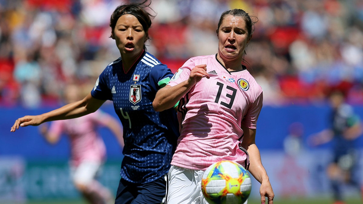 Scotland's Jane Ross, right, is challenged by Japan's Saki Kumagai during the Women's World Cup Group D soccer match between Japan and Scotland at the Roazhon Park in Rennes, France, Friday, June 14, 2019. (AP Photo/David Vincent)