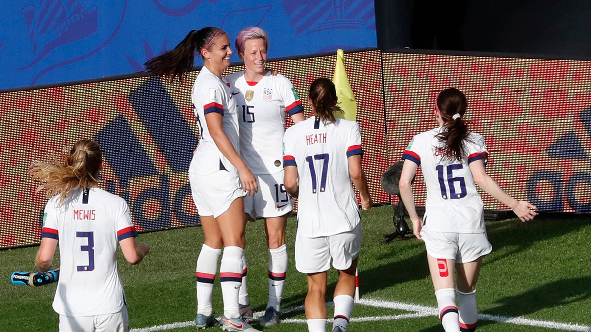 United States' Megan Rapinoe, center, celebrates with teammates after scoring her side's second goal from the penalty spot during the Women's World Cup round of 16 soccer match between Spain and United States at Stade Auguste-Delaune in Reims, France, Monday, June 24, 2019. (AP Photo/Thibault Camus)