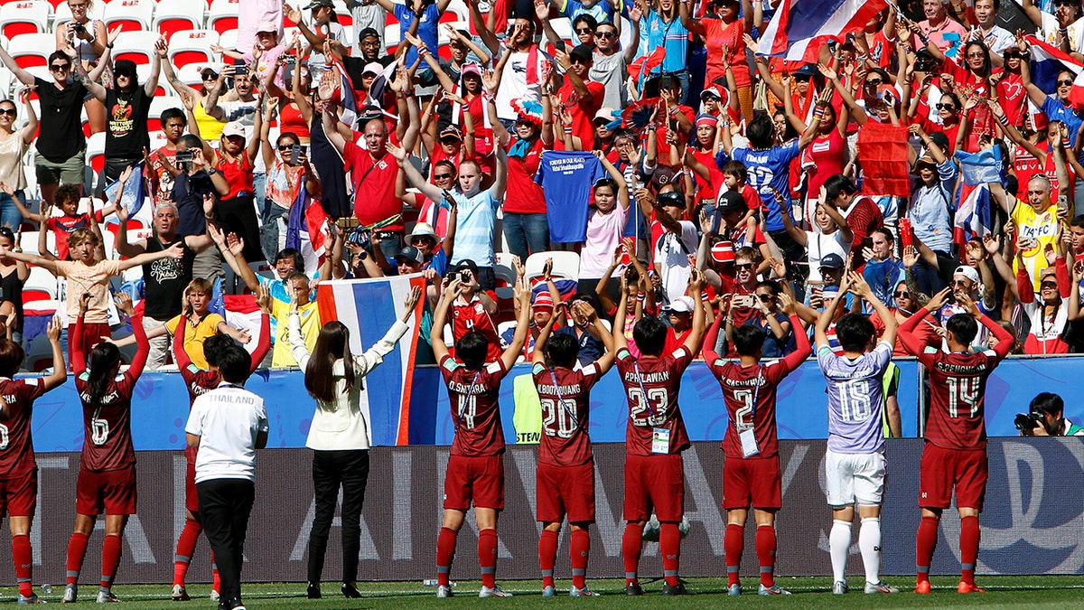 Thailands players celebrate in front of their supporters after the Women's World Cup Group F soccer match between Sweden and Thailand at the Stade de Nice in Nice, France, Sunday, June 16, 2019. Sweden defeated Thailand by 5-1. (AP Photo/Claude Paris)