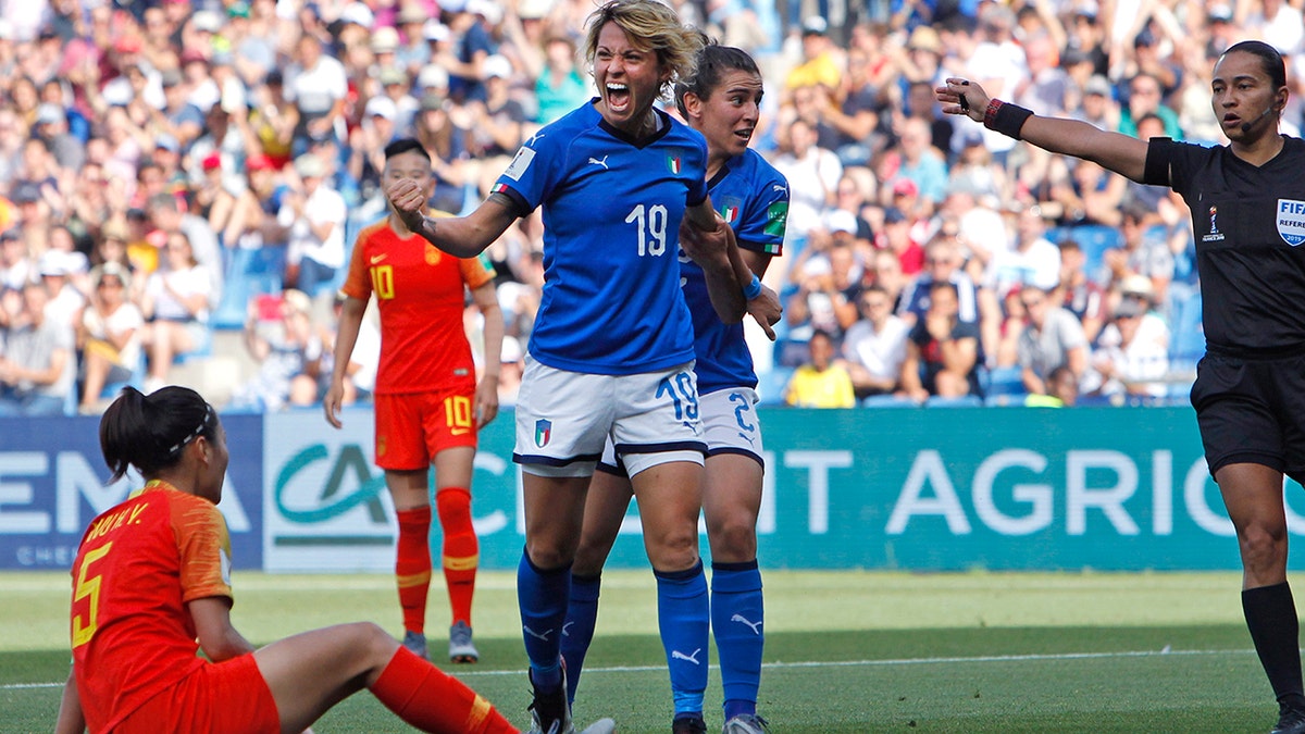 Italy's Valentina Giacinti, center, celebrates after scoring her side's first goal during the Women's World Cup round of 16 soccer match between Italy and China at Stade de la Mosson in Montpellier, France, Tuesday, June 25, 2019. (AP Photo/Claude Paris)