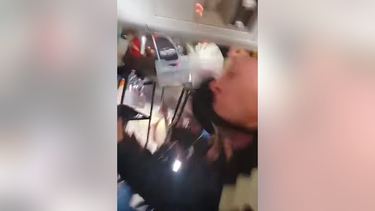 In video recorded of the incident, a flight attendant is seen flying up toward the ceiling of the aircraft, along with the drink cart, which spills over several passengers. One of the soaked travelers can also be seen praying immediately after the cart comes crashing down.