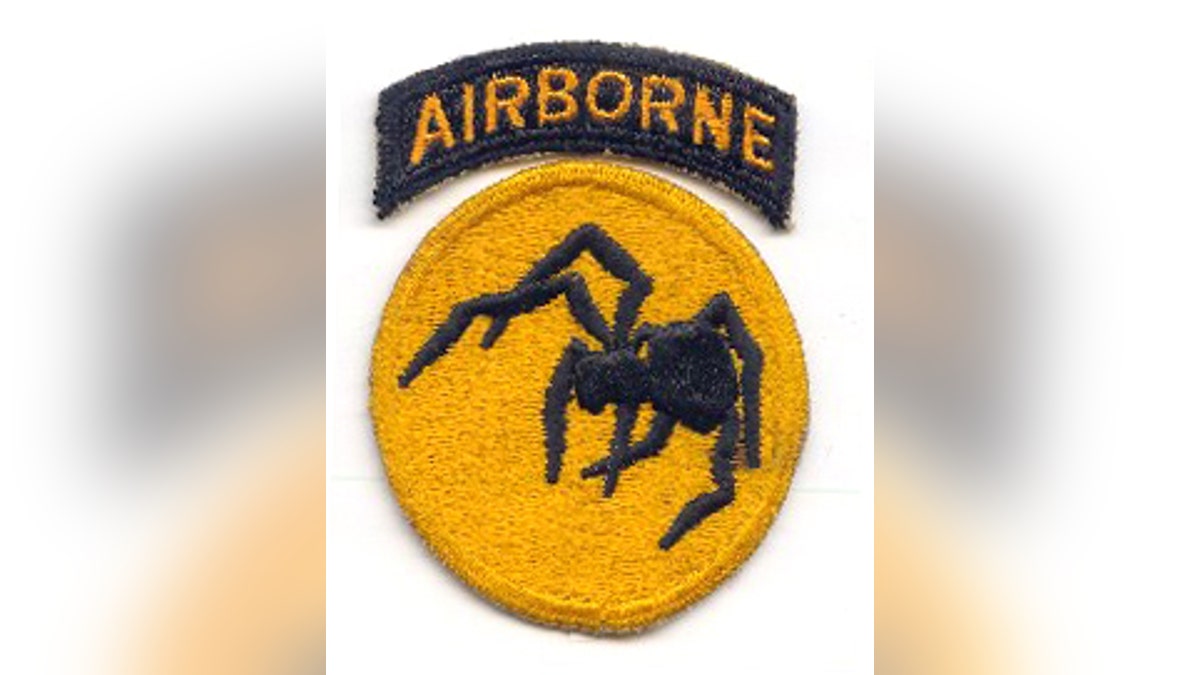 Shoulder patch of the 135th Airborne Division, a non-existent "ghost" unit that was part of the First United States Army Group.