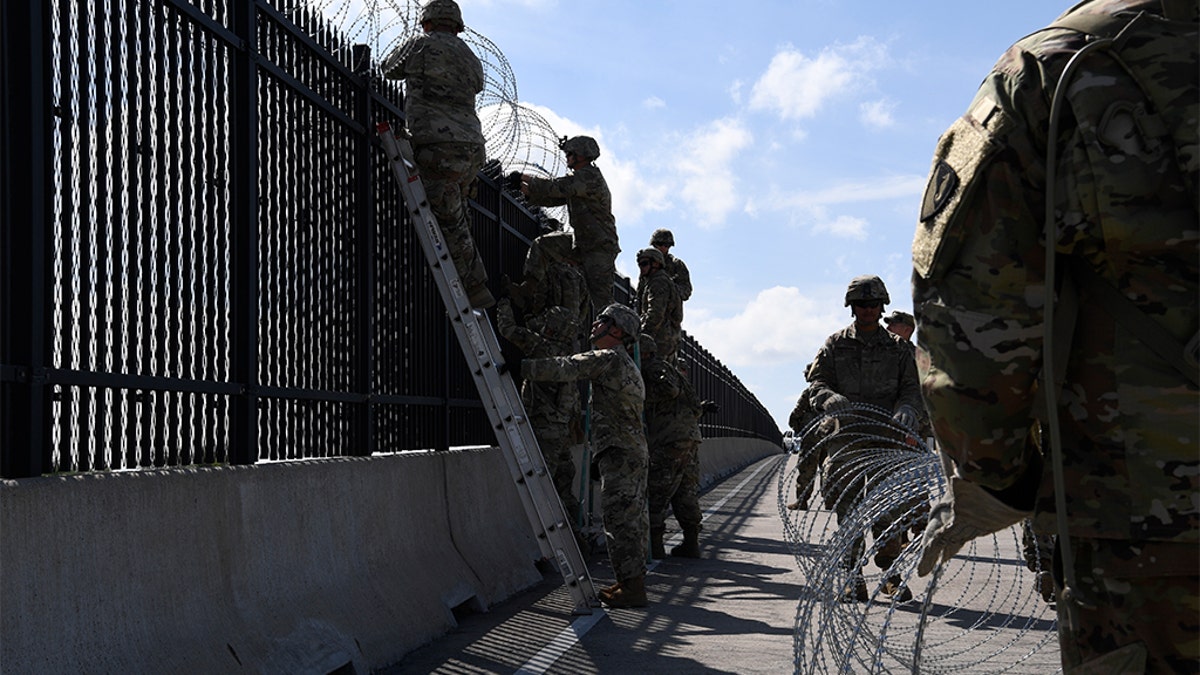 Army engineers install concertina wire on Nov. 5, 2018, on the Anzalduas International Bridge, Texas. (US Air Force photo by Airman First Class Daniel A. Hernandez)