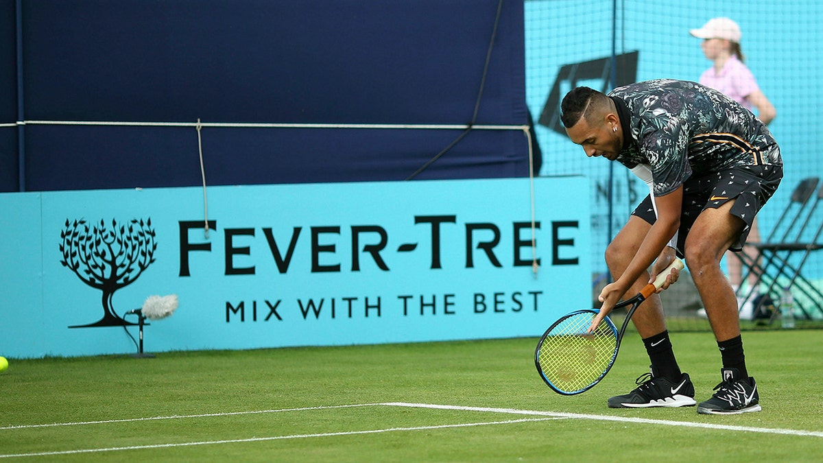 Australia's Nick Kyrgios appeals to the umpire on court one during his tennis match against Spain's Roberto Carballes Baena day four of the Fever-Tree Championship at the Queen's Club, London. (Steven Paston/PA via AP)