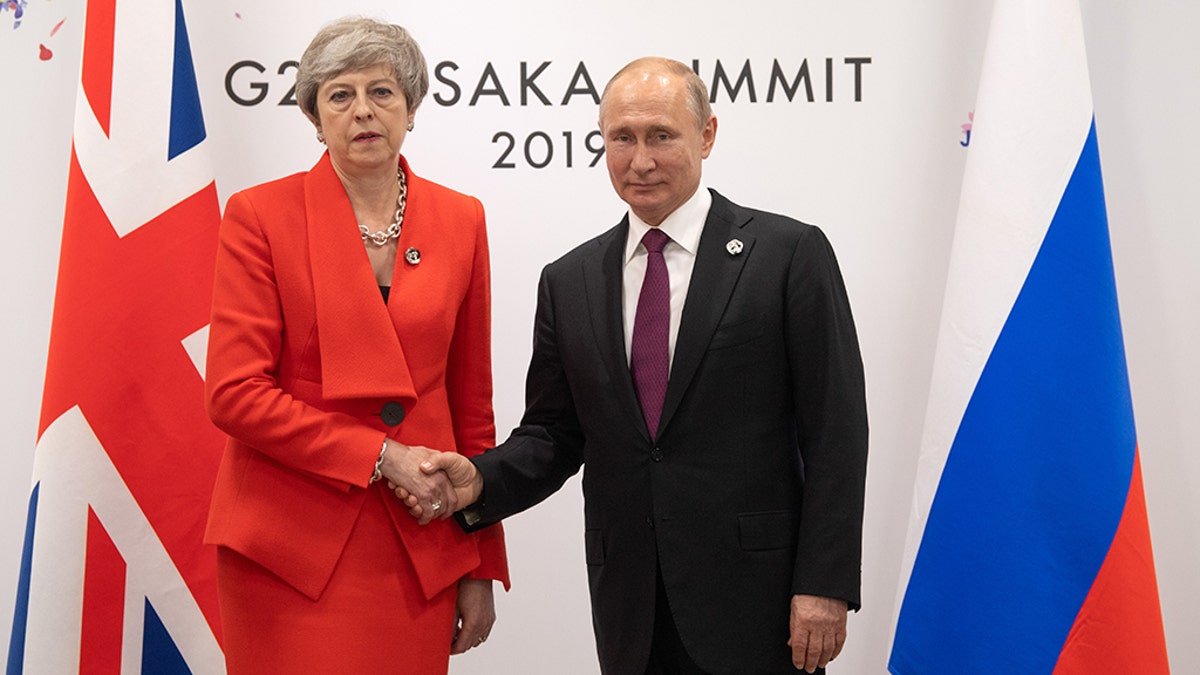 Britain's Prime Minister, Theresa May, offered an icy greeting to Russia's President, Vladimir Putin, during a bilateral meeting on the first day of the G20 summit Friday in Osaka, Japan. (Photo by Carl Court/Getty Images)