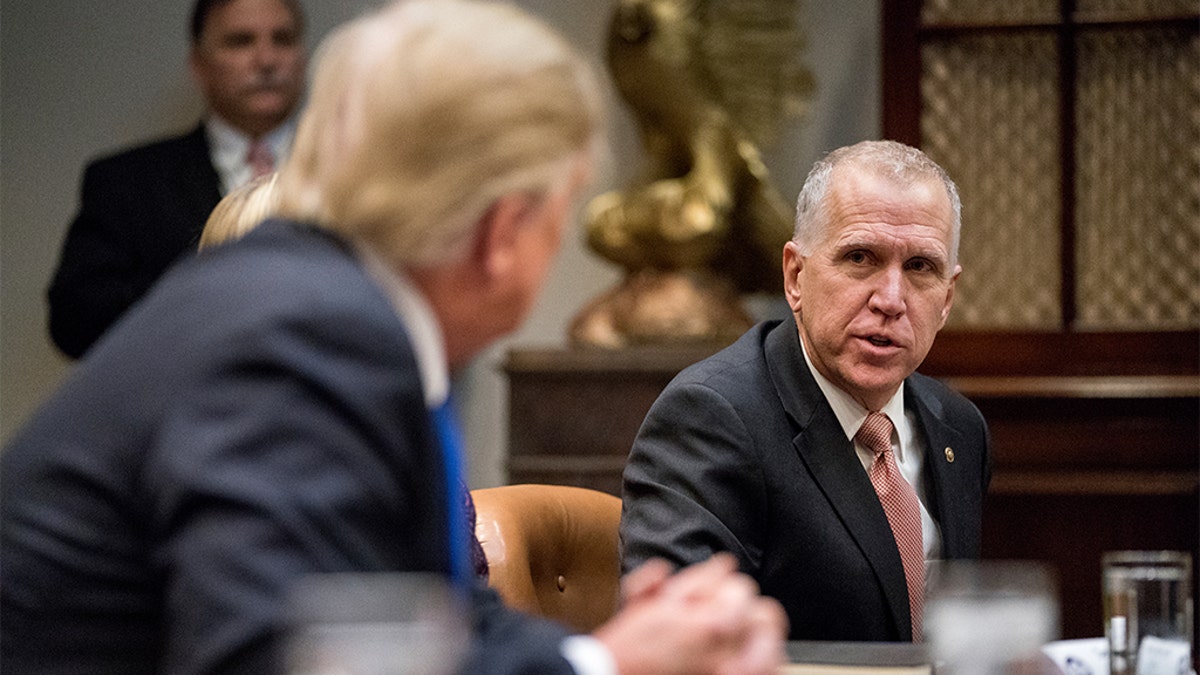President Donald Trump, left, listens as Sen. Thom Tillis, R-N.C., right, speaks during a meeting with Republican Senators on immigration in the Roosevelt Room in the White House, Thursday, Jan. 4, 2018, in Washington. 