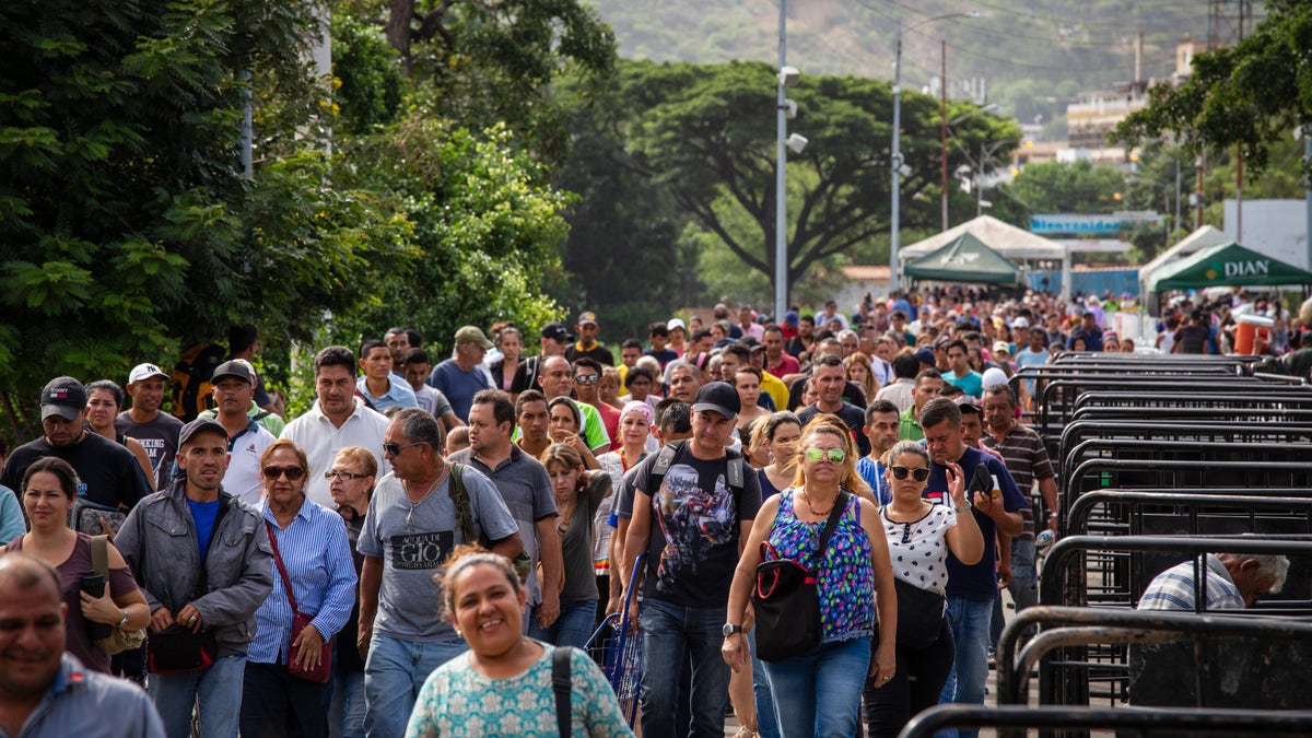 People stream across the Simon Bolivar bridge at the border between Venezuela and Colombia. The border just recently re-opened for all foot traffic. Since then approximately 30,000 people have been coming across each day.