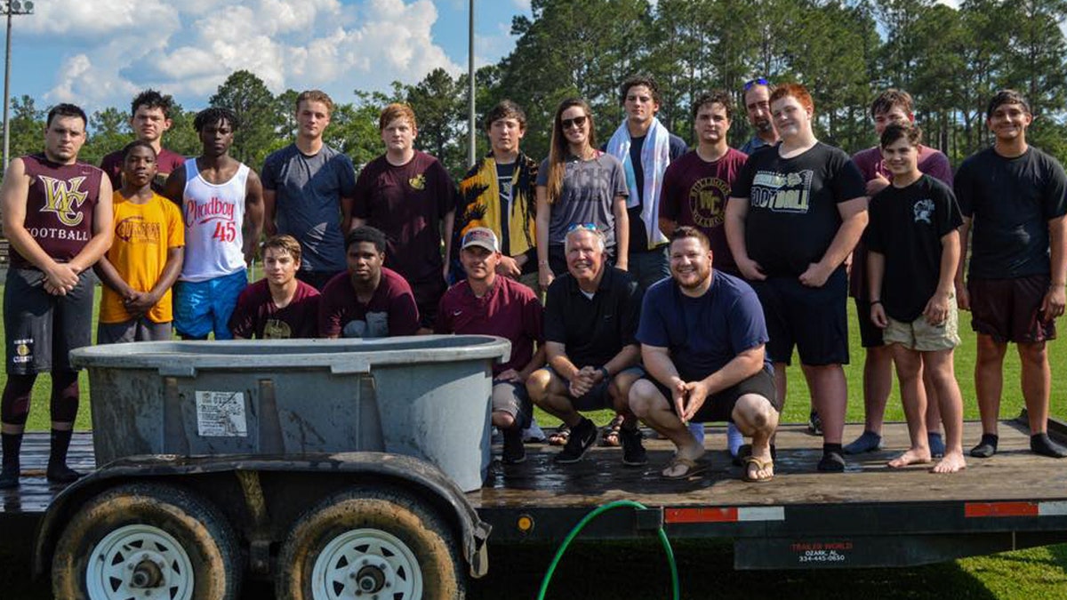 18 football players at Washington County High School in Chatom, Ala. were baptized last month near the field, which upset an atheist group demanding an investigation into "illegal" activities.