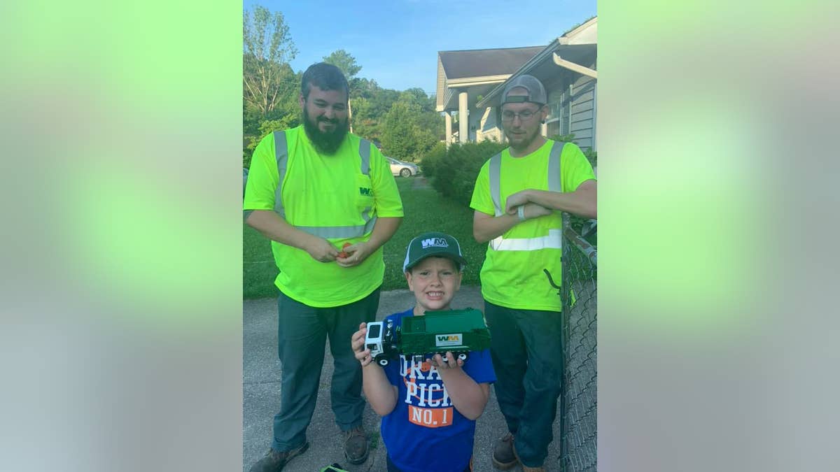 Mark Stephens and Jacob Yoder, pictured here with 6-year-old Noah Cooper, stopped by this Thursday with gifts for their biggest fan.