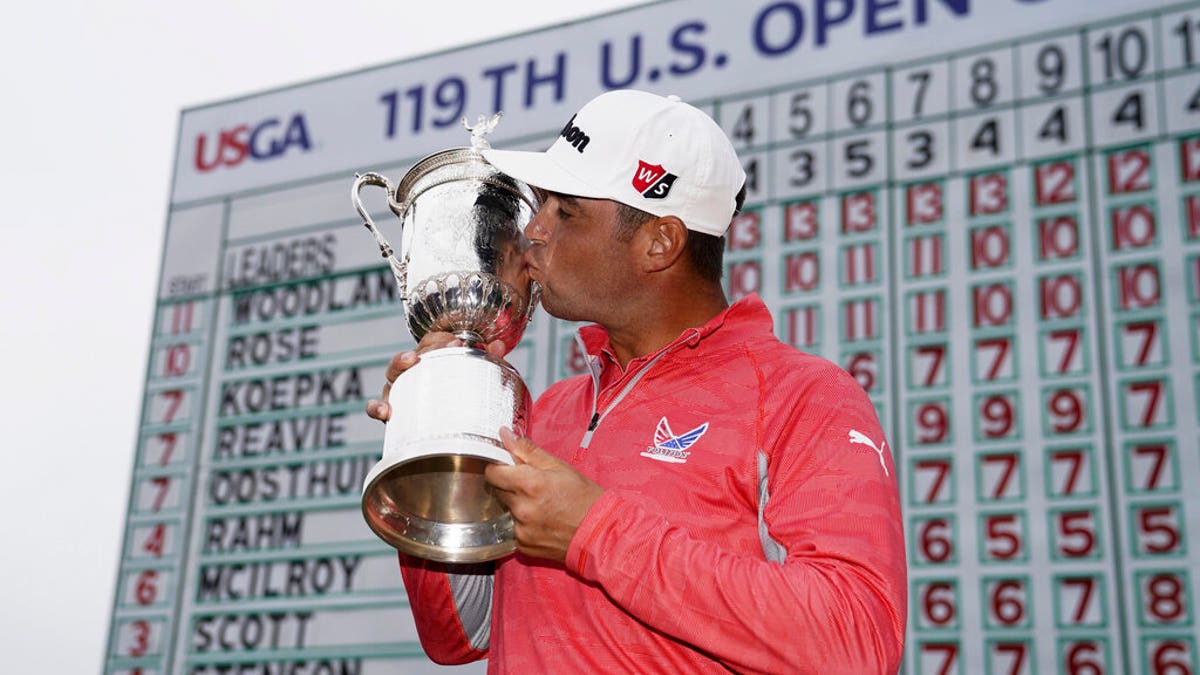 Gary Woodland posses with the trophy after winning the U.S. Open Championship golf tournament Sunday, June 16, 2019, in Pebble Beach, Calif. (AP Photo/Carolyn Kaster)