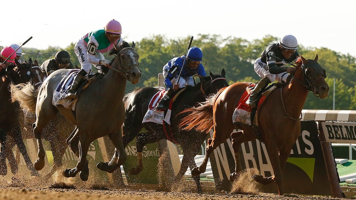 Sir Winston (7), with jockey Joel Rosario up, crosses the finish line to win the 151st running of the Belmont Stakes horse race, Saturday, June 8, 2019, in Elmont, N.Y. (AP Photo/Eduardo Munoz Alvarez)