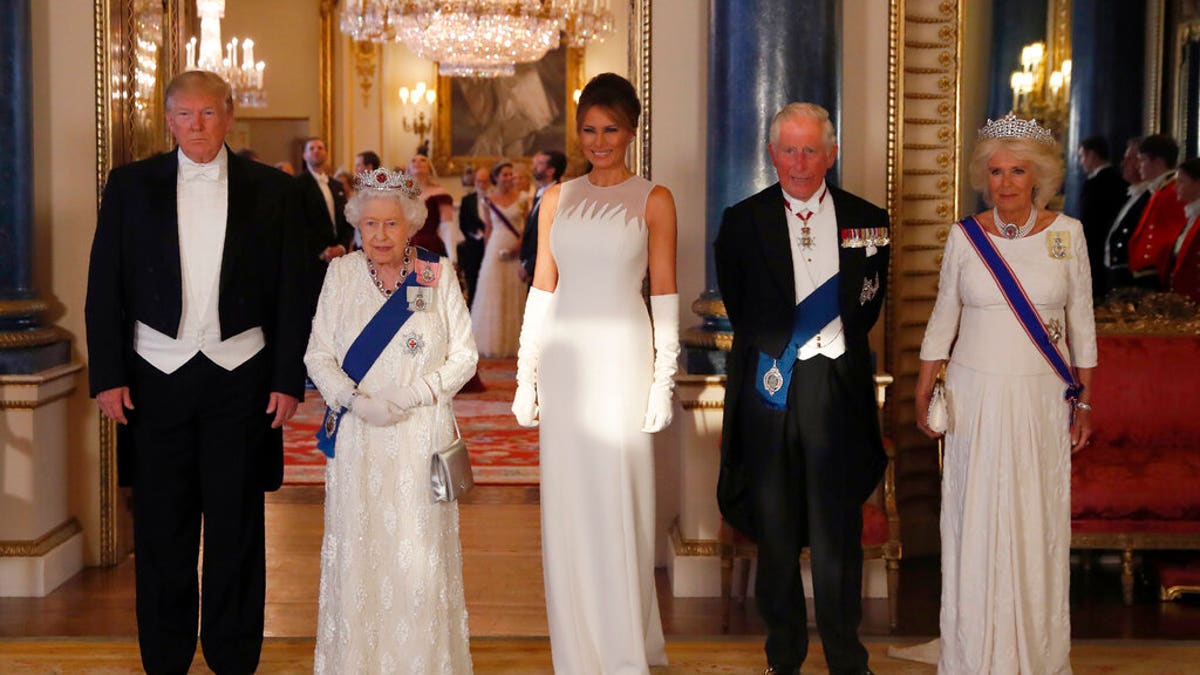 From left, US President Donald Trump, Britain's Queen Elizabeth II, first lady Melania Trump, Prince Charles and Camilla, the Duchess of Cornwall pose for the media ahead of the State Banquet at Buckingham Palace. 