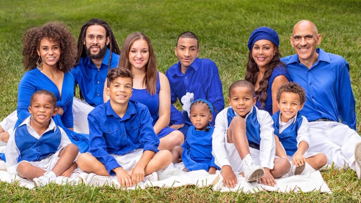 Tony Dungy and his wife Lauren, with 9 of their children.The Dungys have three biological children, seven adopted children, and a foster child.