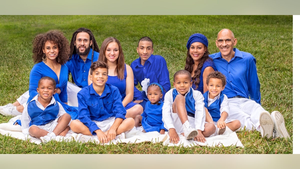 Tony Dungy and his wife Lauren, with 9 of their children.The Dungys have three biological children, seven adopted children, and a foster child.