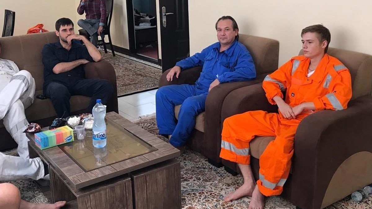 A picture obtained by AFP from the Iranian news agency Tasnim on June 14, 2019 shows what they say are some of the crew of the oil tankers which were targeted in suspected attacks in the Gulf of Oman, after they were reportedly rescued by the Iranian navy on June 13, 2019 in the Iranian southern port town of Bandar-e-Jask.
