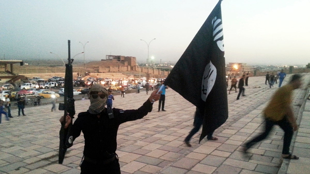 ISIS fighter holding the flag