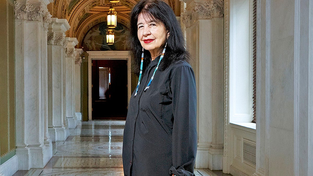 In this June 6, 2019 photo, Joy Harjo, of the United States, poses inside the Library of Congress, in Washington. Harjo has been named the country’s next poet laureate, becoming the first Native American to hold that position. Librarian of Congress Carla Hayden announced Harjo’s appointment, saying in a statement Wednesday, June 19 that the poet helped tell an American story of continuity and disruption, “reckoning and myth-making.” Harjo’s one-year term begins this fall. She succeeds Tracy K. Smith, who served two terms. (Shawn Miller/Library of Congress)