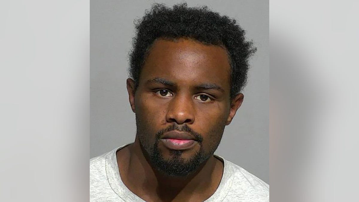 Kenta Evans, 21, allegedly killed a 2-month-old boy by punching him in the head "multiple times with closed fists."