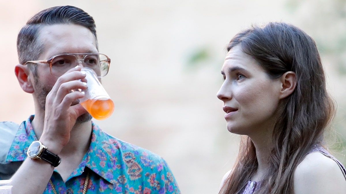 Amanda Knox, right, and her boyfriend Christopher Robinson attend a cocktail for the opening of the Innocence Project conference, in Modena, Italy, Thursday, June 13, 2019.