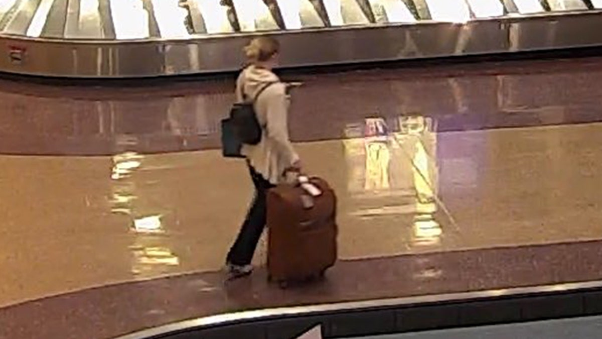 Lueck at a baggage claim area at Salt Lake City International Airport.