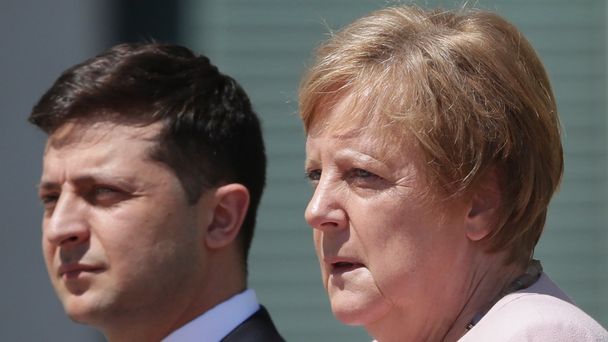 German Chancellor Angela Merkel welcomes Ukraine's President Volodymyr Zelenskiy with military honors for a meeting at the chancellery in Berlin, Germany, Tuesday, June 18, 2019.