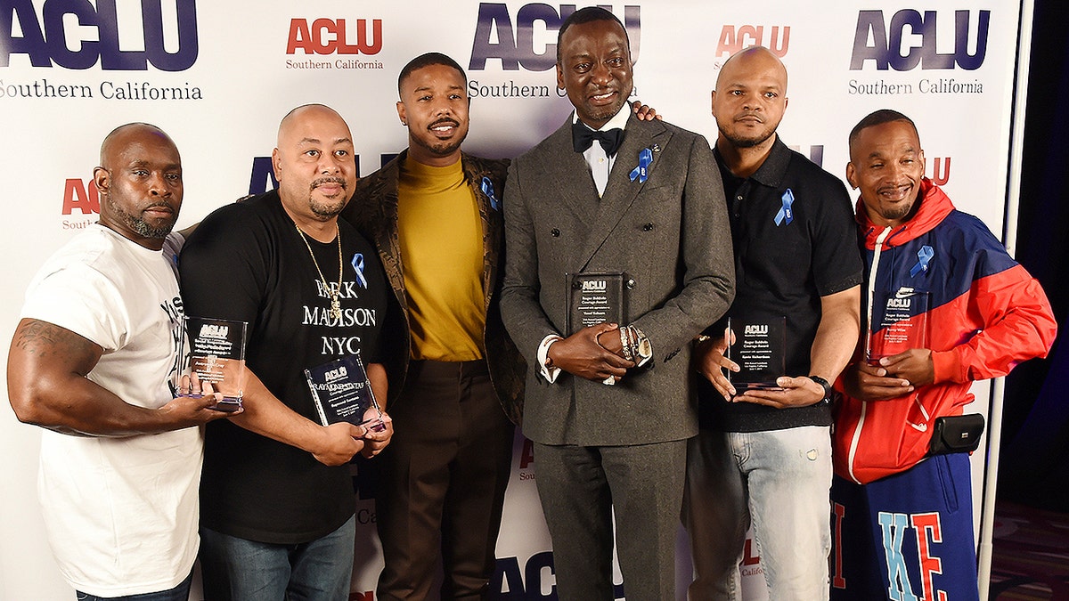 Presenter Michael B. Jordan, third from left, poses with, from left, honorees Antron McCray, Raymond Santana, Yusef Salaam, Kevin Richardson and Korey Wise at the ACLU SoCal's 25th Annual Luncheon at the JW Marriott at LA Live, Friday, June 7, 2019, in Los Angeles. (Photo by Chris Pizzello/Invision/AP)
