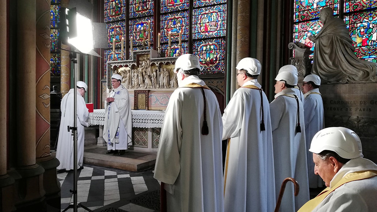 For security reasons, only about 30 people — mainly priests, canons and church employees — were admitted inside the cathedral for the service, while Aupetit and others wore construction worker's helmets. Some of the workers rebuilding the church were also invited.