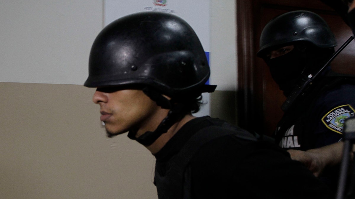 Rolfy Ferreyra Cruz, a suspect in connection with the shooting of former Boston Red Sox slugger David Ortiz, is taken to court by police in Santo Domingo, Dominican Republic, Friday, June 14, 2019. Ortiz was shot in the back at a bar in the Dominican Republic on Sunday, June 9. (AP Photo/Roberto Guzman)